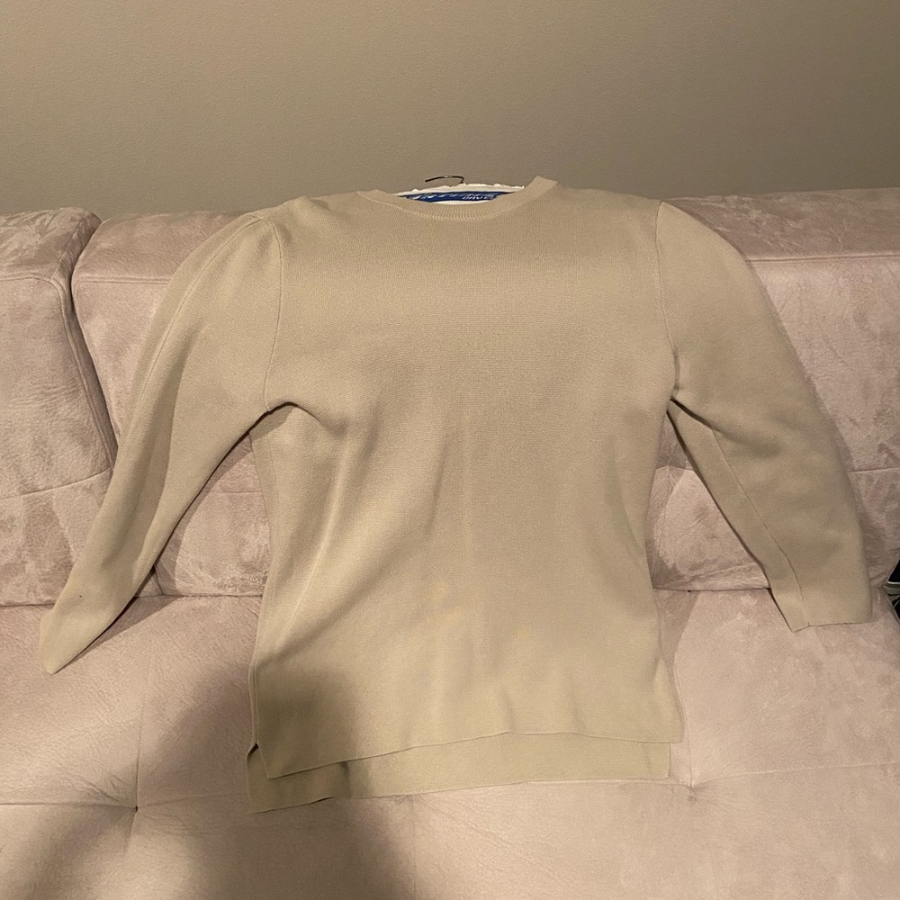 Cream colored long sleeve H&M shirt.